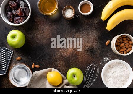 vegan dessert ingredients and utensils on dark background Stock Photo