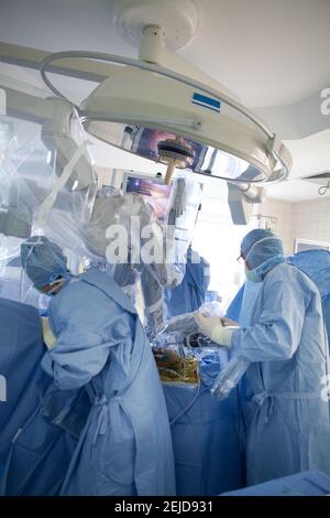 Robot surgeon performing prostatectomy, prostate removal. Stock Photo