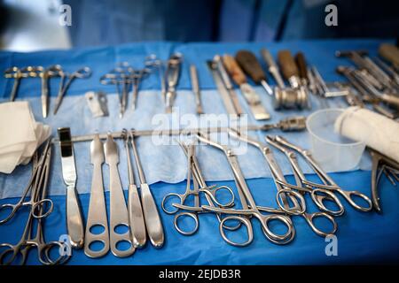 Table of surgical instruments for orthopedics in an operating theater. Stock Photo