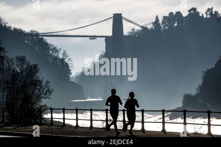 File photo dated 10/01/21 of joggers exercising along the River Avon in Bristol. Prime Minister Boris Johnson has unveiled long-awaited plans on how lockdown measures will be eased in England. Issue date: Monday February 22, 2021. Stock Photo