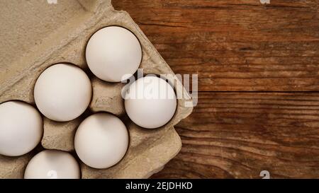 White eggs on wooden background. Easter and healthy food breakfast cooking concept Stock Photo