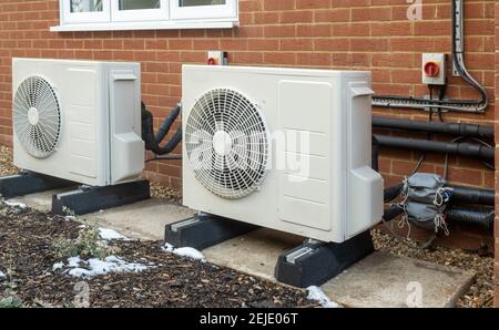 Two air source heat pump units installed on a modern house Stock Photo