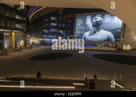 People gather quietly in front of a large image of former Los Angeles basketball player Kobe Bryant at Chase Center in San Francisco, California, United States on January 27, 2020 to pay tribute the legendary sportsman. The world famous NBA player was killed in a helicopter accident on January 26, 2020 when his private Sikorsky S-76B helicopter crashed into a mountain in Calasabas, California and killed 9 people, including his daughter Gigi Bryant. (Photo by Yichuan Cao/Sipa USA)