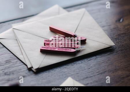 Man makes the stamp using sealing wax on the envelope Stock Photo