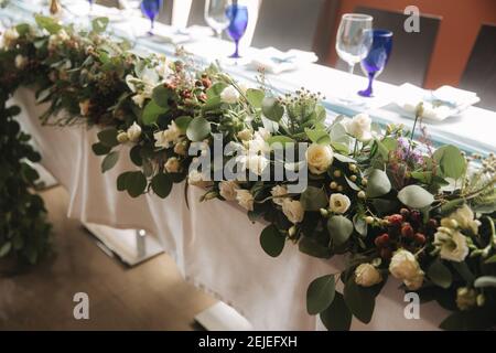 Decorated table for wedding celebration. Bright restaurand with a lot of windows Stock Photo