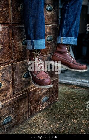 Blue jeans and work boots. Pants on old 