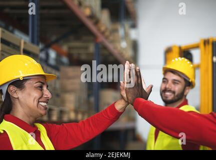 Happy team enjoying working together in delivery warehouse - Logistic and industrial concept Stock Photo