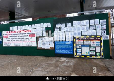 BUREAUCRACY. A gas station under construction in Flushing, Queens, New York  with 73 signs, warnings, rules and notices. Stock Photo