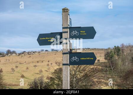 Metal fingerpost signs for cycling paths and footpaths near Lowther Castle in the English Lake District Stock Photo