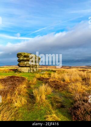 Winter view of the Eagle Stone rock formation near Baslow in the Peak District National Park Derbyshire England UK Stock Photo