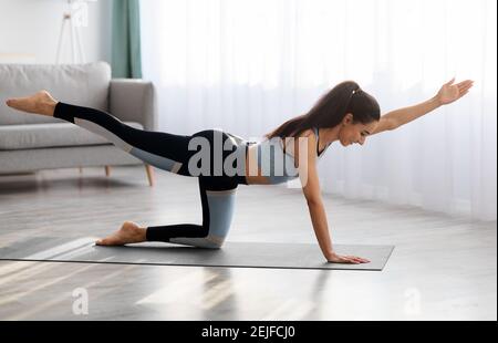 Young woman doing morning yoga at home Stock Photo