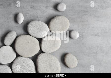 Flat lay composition with grey spa stones on grey background Stock ...