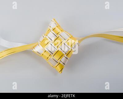 The beutiful white and gold colors ribbon of ketupat raya Stock Photo