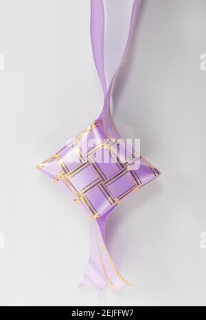 The beutiful purple colors ribbon of ketupat raya Stock Photo - Alamy
