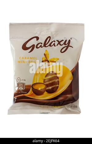 Packet of Galaxy Caramel Mini eggs isolated on white background Stock Photo