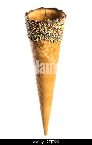 Empty crunchy ice cream cone with sugar pearls on white background Stock Photo