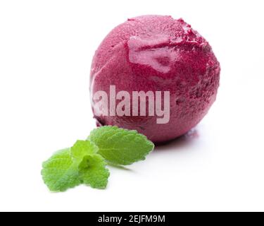 single blackberry ice cream scoop with mint leaf on white background Stock Photo