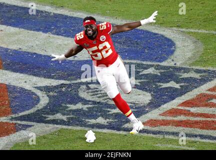 Kansas City Chiefs' Demone Harris (52) plays with the confetti, at