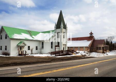 Lake Pleasant, New York, USA. February 17, 2021. The United Methodist and Saint James Major churches along Route 8 in the Adirondack Mountains of upst Stock Photo