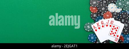 Cards and poker chips on a green background. Stock Photo