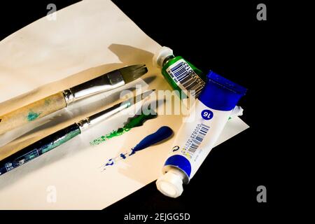 paint art craft watercolor paints and brush, colorful art. Paintbrushes set, close-up. Stock Photo