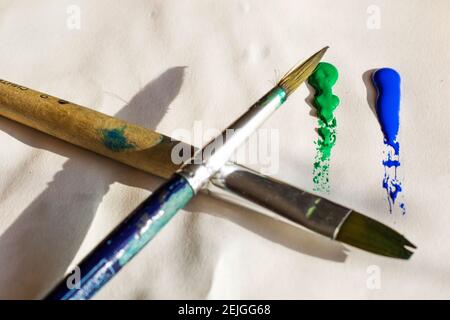 paint art craft watercolor paints and brush, colorful art. Paintbrushes set, close-up. Stock Photo