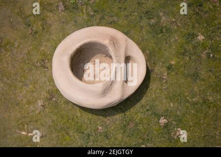 This is a handmade Bangladeshi clay stove. It is used for cooking in rural Bengal. Stock Photo