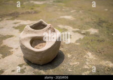 This is a handmade Bangladeshi clay stove. It is used for cooking in rural Bengal. The image highlights the heritage of the village. Stock Photo