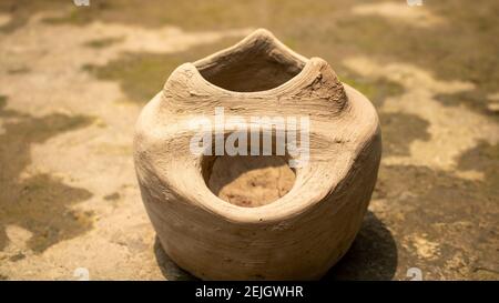 This is a handmade Bangladeshi clay stove. It is used for cooking in rural Bengal. The image highlights the heritage of the village. Stock Photo