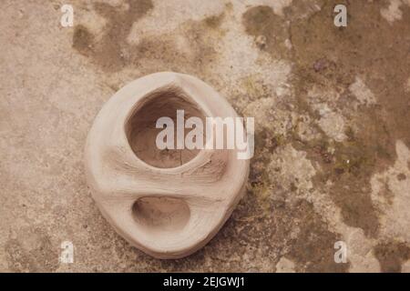 This is a handmade Bangladeshi clay stove. It is used for cooking in rural Bengal. The image highlights the heritage of the village. Stock Photo