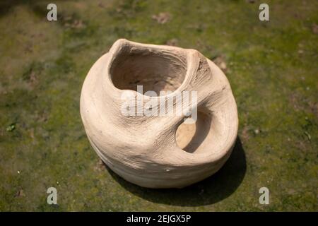 This is a handmade Bangladeshi clay stove. It is used for cooking in rural Bengal. The image highlights the heritage of the village. Stock Photo