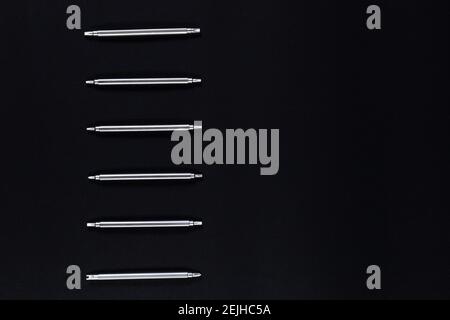 Small metal screwdrivers for electronic on black background with copy space. Stock Photo