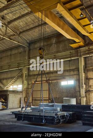 Manufacturing concrete slabs. reinforced concrete production. Workers working with metal, welding reinforcement for concrete reinforcement. House-buil Stock Photo