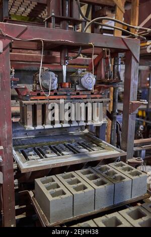 Cinder blocks lie on the ground and dried. on cinder block production plant Stock Photo