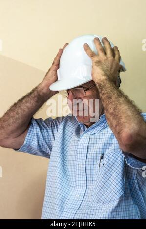 Civil engineer putting his helmet on Stock Photo