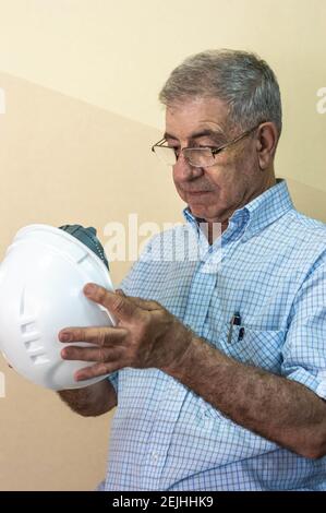 Civil engineer putting his helmet on Stock Photo