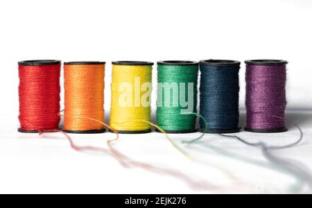 Spools of thread in colors of the rainbow on white background Stock ...