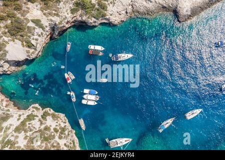 Aerial overhead drone shot of yachts at Stiniva cove Adriatic sea on Vis Island in Croatia summer Stock Photo