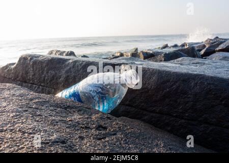 Plastic pollution with single use plastic bottles and other junk left by visitors at Pondicherry beach in Tamil Nadu, India Stock Photo