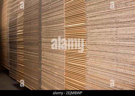 Stack of flat industrial folding cardboard packaging boxes Stock Photo