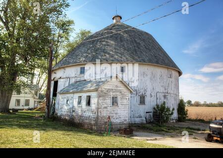 A Round Barn in Indiana, United States. Round barn is a historic barn design that could be octagonal, polygonal, or circular Stock Photo