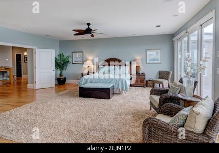 Large luxury bedroom suite with large glass doors, Stock Photo