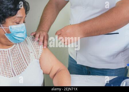 close-up view of the vaccination process in the elderly Stock Photo