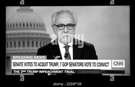 A CNN screen shot of news anchor Wolf Blitzer reporting on the Senate impeachment acquittal of former U.S. President Donald Trump. Stock Photo