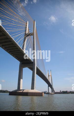 Wide angle view of the Tsubasa - Neak Loeung Bridge spanning the Mekong river in Phnom Penh Cambodia Asia Stock Photo