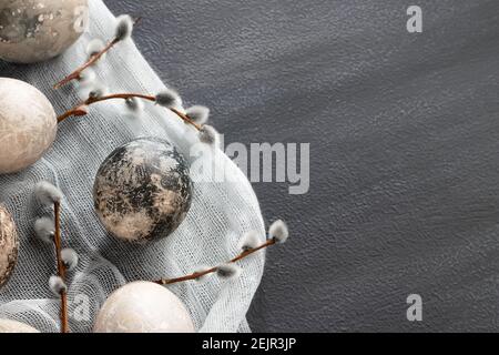 Easter composition - several painted with natural dyes with marble effect on the table, top view, copy space. Stock Photo