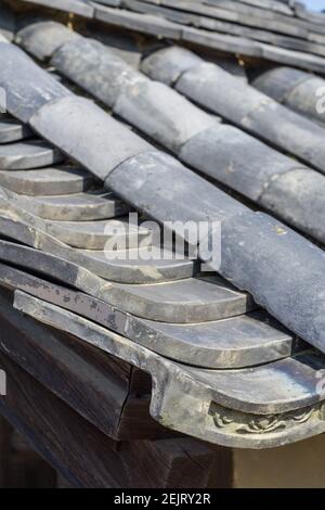 Traditional Japanese grey ceramic roofing tiles or kawara, on a roof at Kofukuji temple in Nara, Japan Stock Photo