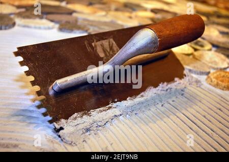 A rTrowel notch square for mortar on a stones background Stock Photo
