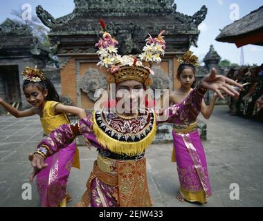 Asia, Indonesia, Bali, Portrait of a beautiful smiling Balinese legong dancer wearing traditional dance costume Stock Photo