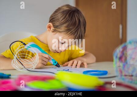 Kid using 3d printing drawing pen. Creative, leisure, technology education concept Stock Photo